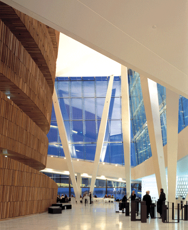 A tall oak wall separates the auditoria from the foyer