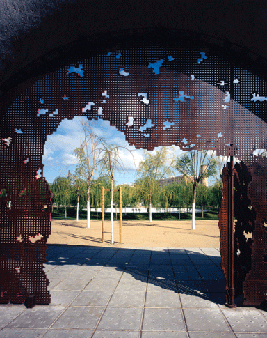 The entrance gates are peppered with pixellated holes 
