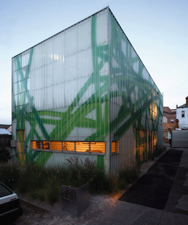 The building is clad in Radiata pine encasing a glass façade