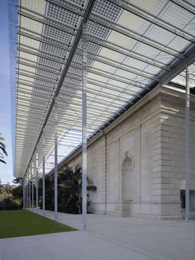 The solar canopy covers the preserved neoclassical facade of the old headquarters