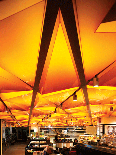 The geometric ceiling references Milan’s Duomo, which the food hall overlooks