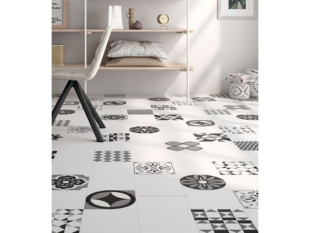a room with black and white geometric floor tiles copy