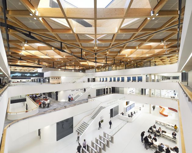 The centre's enormous central space contains tiered shared collaborative workspaces. Photo: Hufton + Crow.