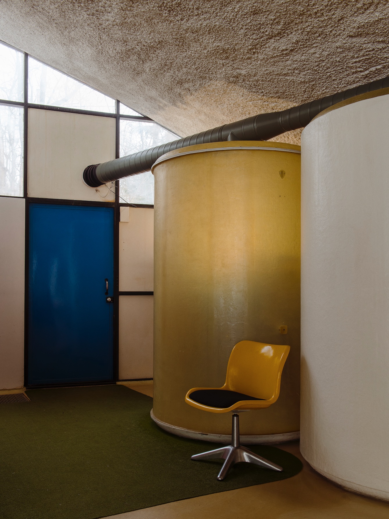 Kukkapuro House Finland yellow chair blue door